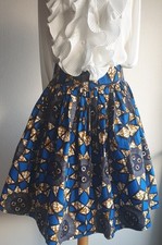 Jupe  Wax mi longue  évasée  2 poches intérieure  Taille 42