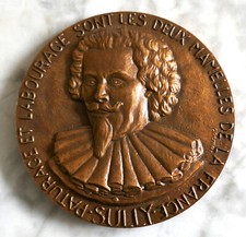 MEDAILLE EN BRONZE  - SIGNE