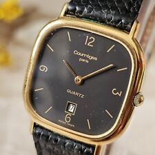 Montre Vintage Courrèges Paris en plaqué or fond acier quartz Dateur. pile...
