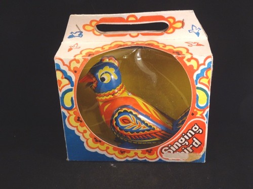 Ancien jouet oiseau tôle