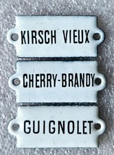 Plaque émaillée Kirsch Vieux, Cherry-Brandy & Guignolet Meuble Métier 3,7x1,5cm