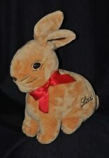 Peluche doudou lapin LINDT ruban rouge poche arrière 23/31 cm TTBE