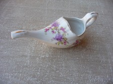 canard de malade en porcelaine avec fleurs