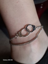 Chaine de cheville double chaîne argenté et menotte, réglable. Neuf