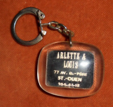 Porte-clés  Arlette & Louis 77 Av. G PERI ST OUEN Coiffure peigne ciseaux parfum