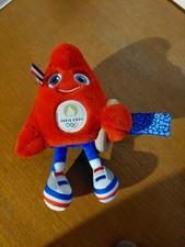 mascotte jeux olympiques 2024 pantin d'éveil avec hochet et anneau en bois 