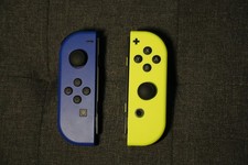 Manettes Joy-Con Nintendo Switch – Bleu/ Jaune Fluo - peu utilisées