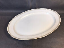 Grand plat ovale de service en porcelaine de Sologne Larcheveque avec dorures