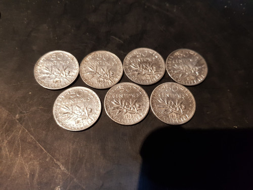 Une pièce 50 centimes - une,