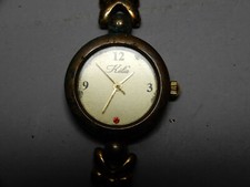 montre a quartz dorée femme