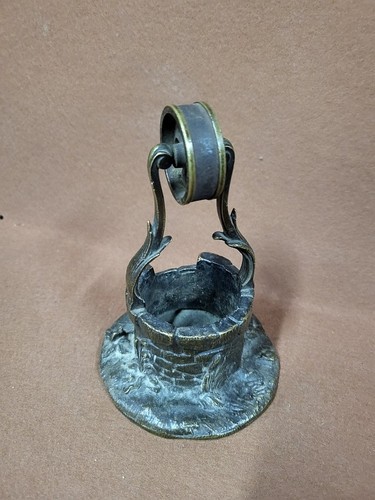 Sculpture puits en - en, bronze