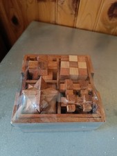 Casse Tête en Bois coffret de 4 jeux neufs.