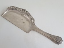 Pelle en métal argenté pour