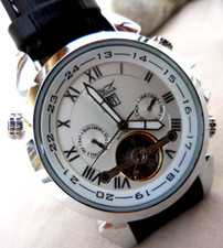 ELEGANTE Mtr JARAGAR  AUTOMATIQUE A SPIRALE VISIBLE "TOUBILLON" TBEG & FONCTIONS