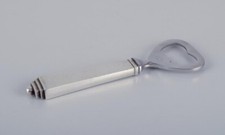 Georg Jensen Pyramid. Ouvre-bouteille en argent sterling et en acier inoxydable.