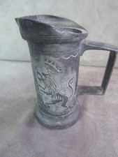 MESURE XIXe, en étain ciselé. DECILITRE. Décor de LYS et de LION.