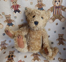 "TIM" OURS ASSIS NON ARTICULE BON ETAT AVEC SON ETIQUETTE / H 23 cm assis