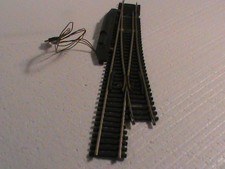 long aiguillage HO ROCO. AIG ELECTRIQUE A GAUCHE/CABLE/LONG 30.2CMS/OCC