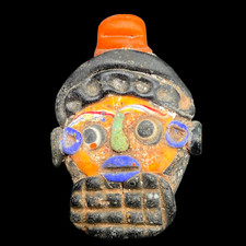 Ancien pendentif visage humain