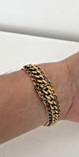 Bracelet  plaquage or de la marque Exellence .