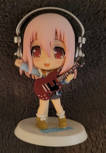 Figurine super sonico guitare - super,