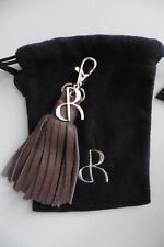 Bijou de sac à main porte-clé doré pompon franges cuir marron Jacques Rostaing