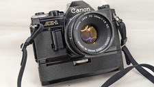 Canon AE-1 noir avec objectif Canon FD  SC 1.8/50mm + moteur  winder A