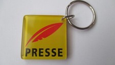 Porte clé publicitaire Nouveau logo PRESSE L.P.M. PROMODERN Agencement  magasin