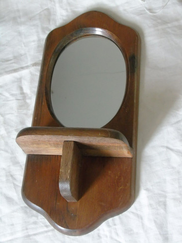 Joli petit miroir ovale mural