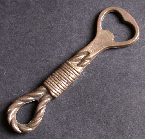 Decapsuleur bronze forme - en,