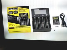 Chargeur de Batterie Universelle 4 slots . État neuf.