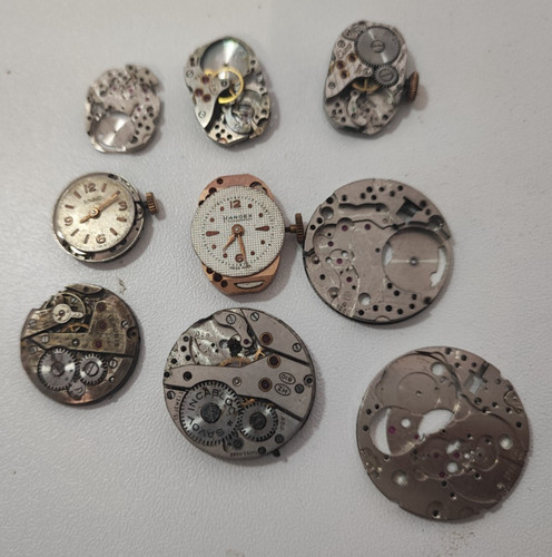 Watch main plate and movement - and,