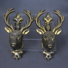 Supports muraux cerf années 80 pour épée ou pistolet (paire)