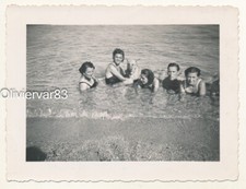 Vintage photo - 4 young women, 1 man and 1 dog bathing on a beach