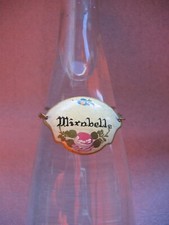 Ancienne petite plaque émaillée pour col ou goulot de bouteille de MIRABELLE