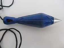 Fil à plomb ancien en métal émaillé