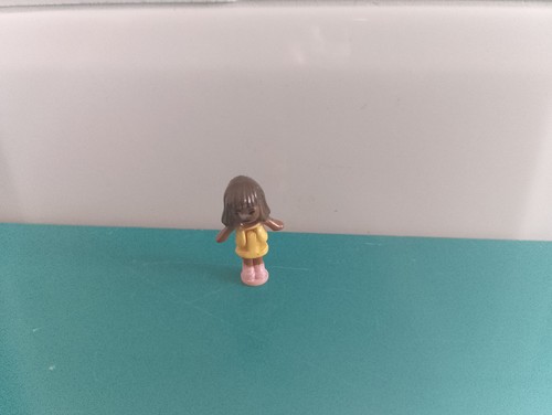 Polly pocket figurine doll