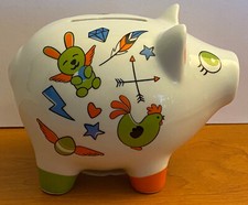 Tirelire Cochon en céramique avec différents motifs peint dessus