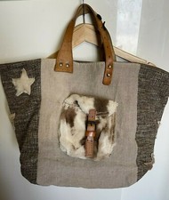 Sac a mains Pomponette en tissue et cuire. 