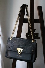 Louis Vuitton sac à main modèle Vavin en cuir noir