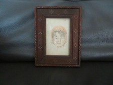 reproduction tête d'enfant dans son cadre en bois