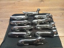 Lot de 10 superbes porte couteaux métal argenté dans le goût de Sandoz Gallia