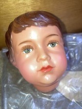 (M)  tête de poupée