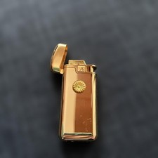 Briquet doré élégant corps doré avec rabat d'occasion