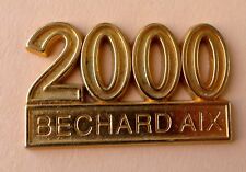 Fève / plaque pub perso - métal doré - 2000 - Pâtisserie Béchard Aix en Provence