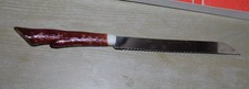 ANCIEN COUTEAU A PAIN PRADEL MANCHE PLASTIQUE DECOR EN PIEDS DE BICHE CHEVREUIL