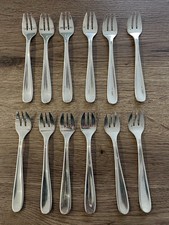 12 anciennes fourchettes à huitre en métal argenté Christofle modèle Dax