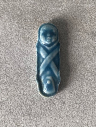 Feve bébé emmailloté - le,