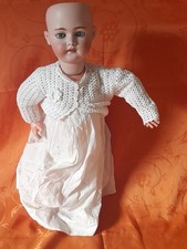 Poupée tete en  porcelaine