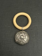 Ancien hochet Art déco en argent massif